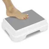 Non-slip bath step to reduce the step height into a bath or shower